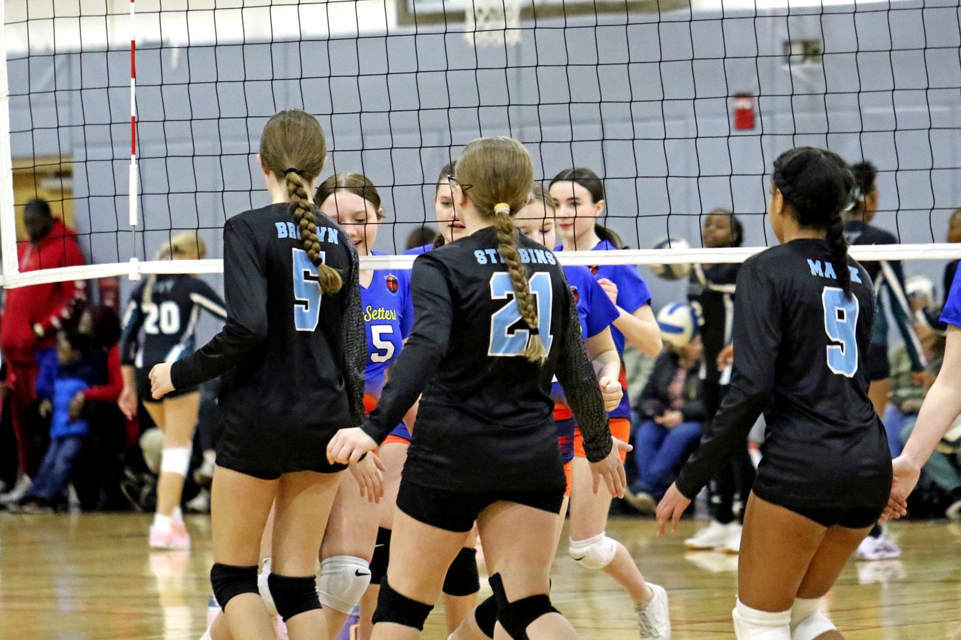 14U team in action at the net