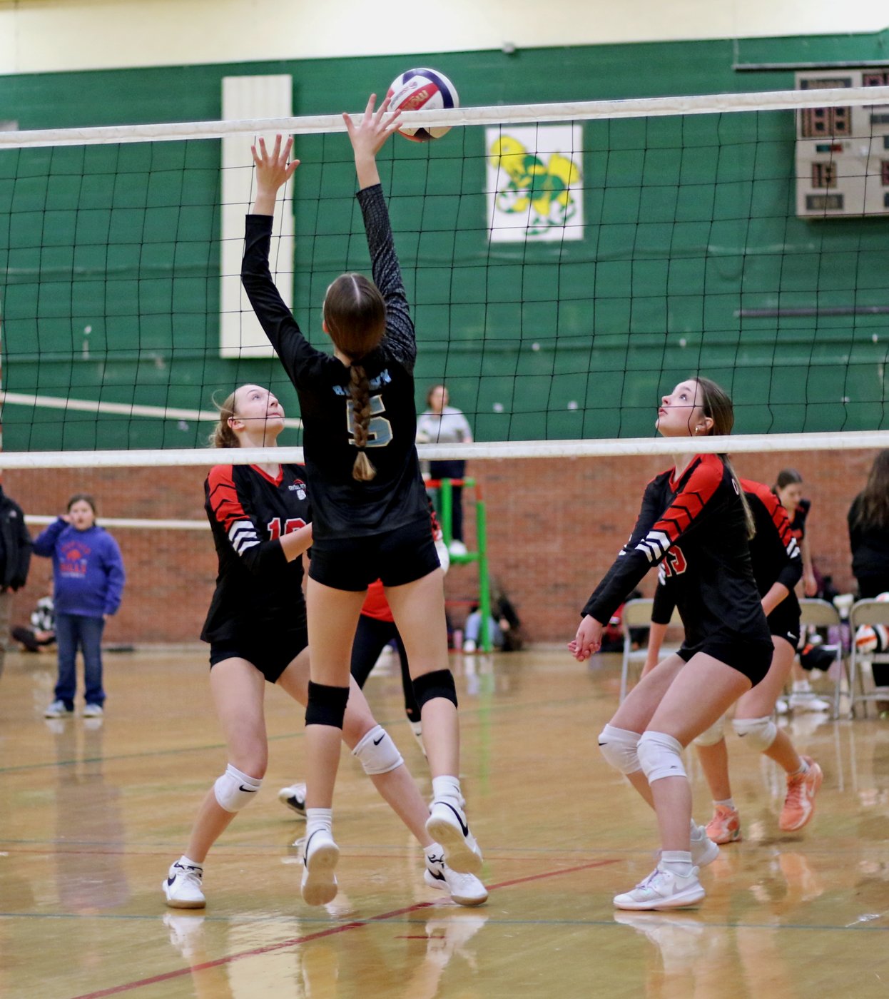 14U player blocking at the net