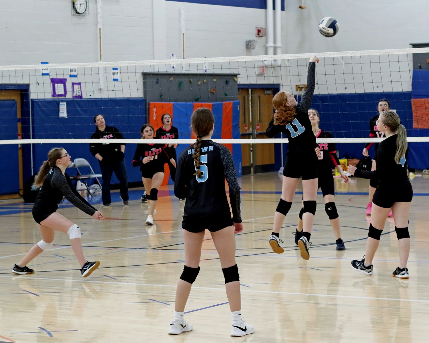 14U players celebrating a point