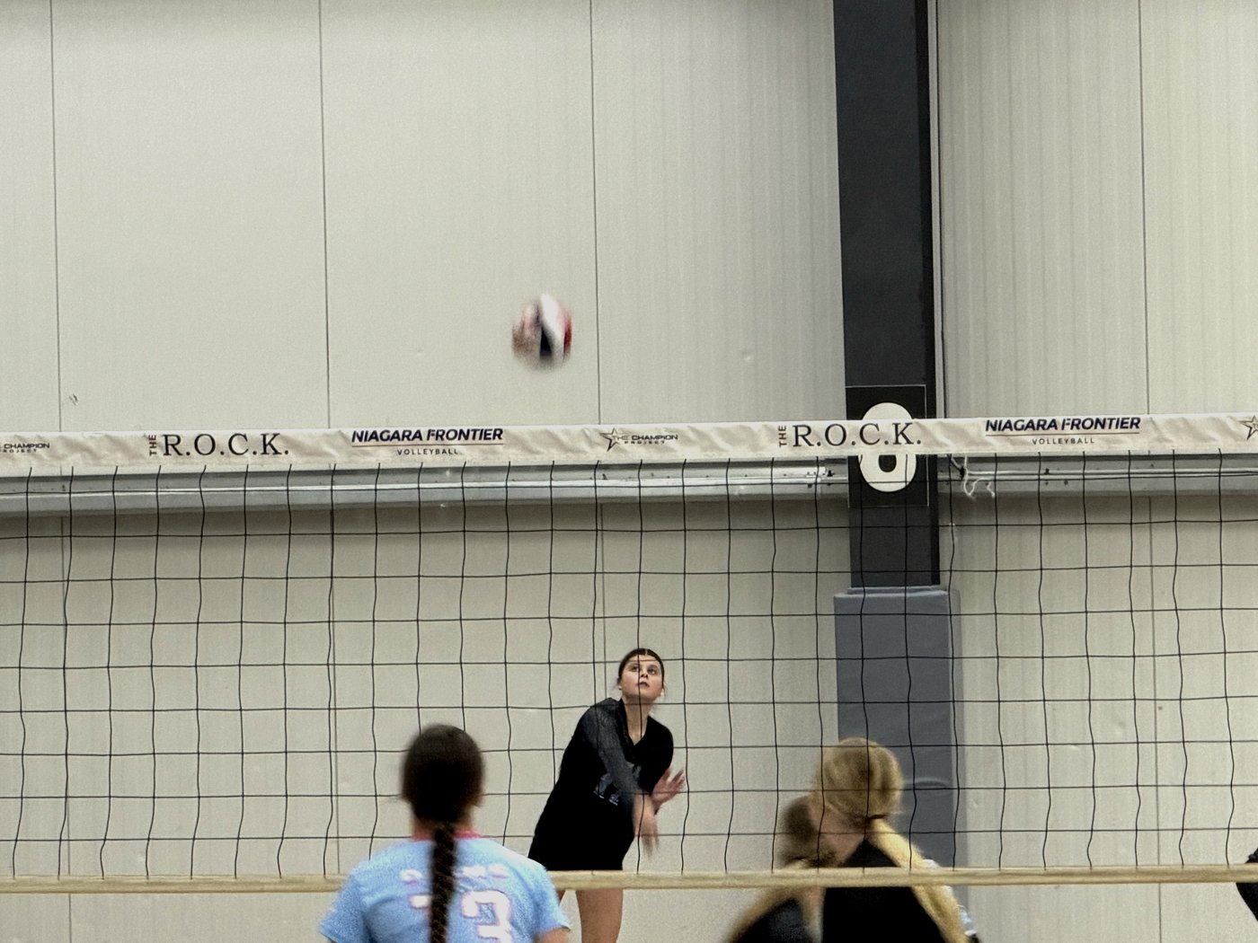16U player serving