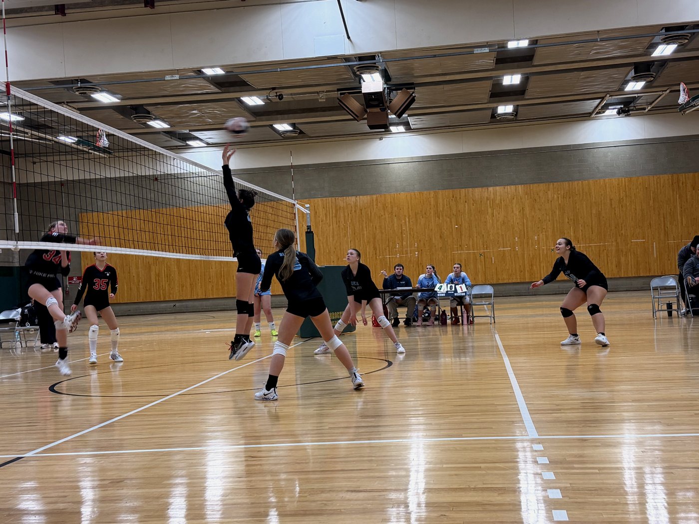 16U players converging on the ball